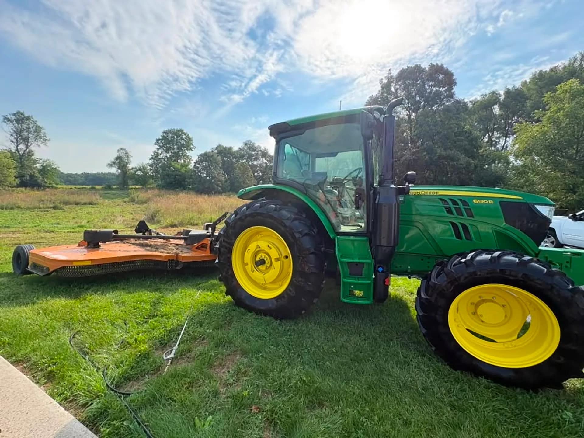 John Deere tractor and mower deck washed down in the yard
