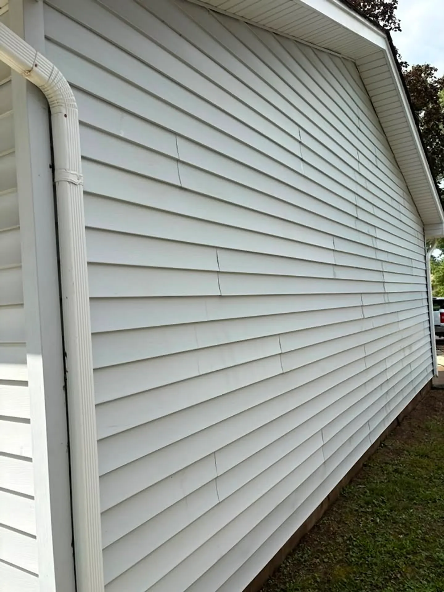 Vinyl siding on a house corner after soft washing